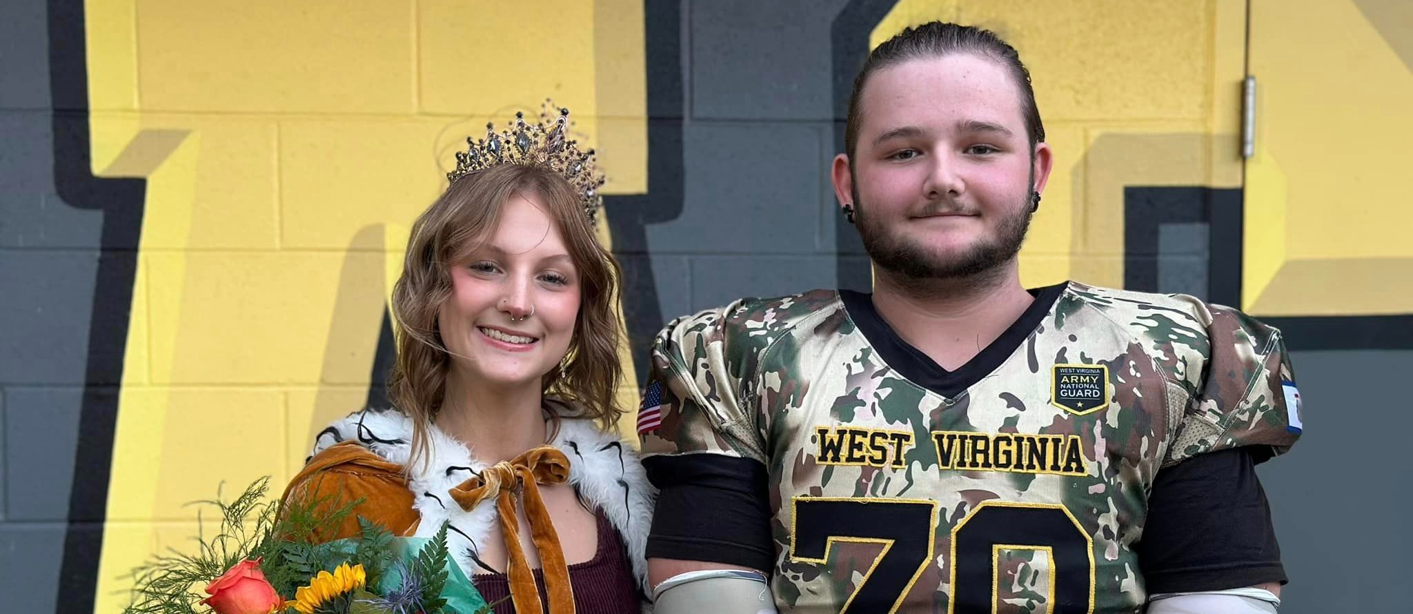 VHS Homecoming King & Queen posing after being crowned