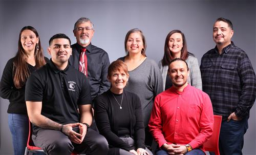 adults in group photo happy and smiling