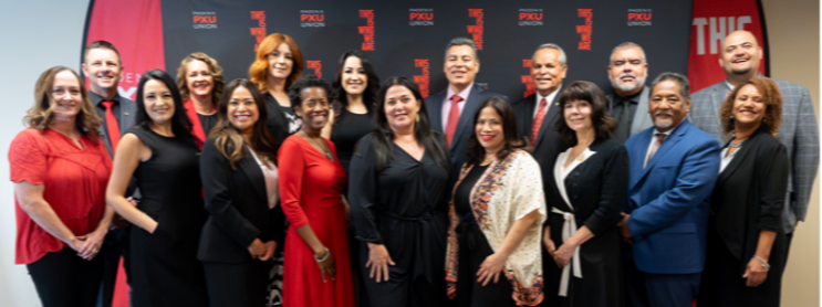 group of staff members together smiling for a group photo