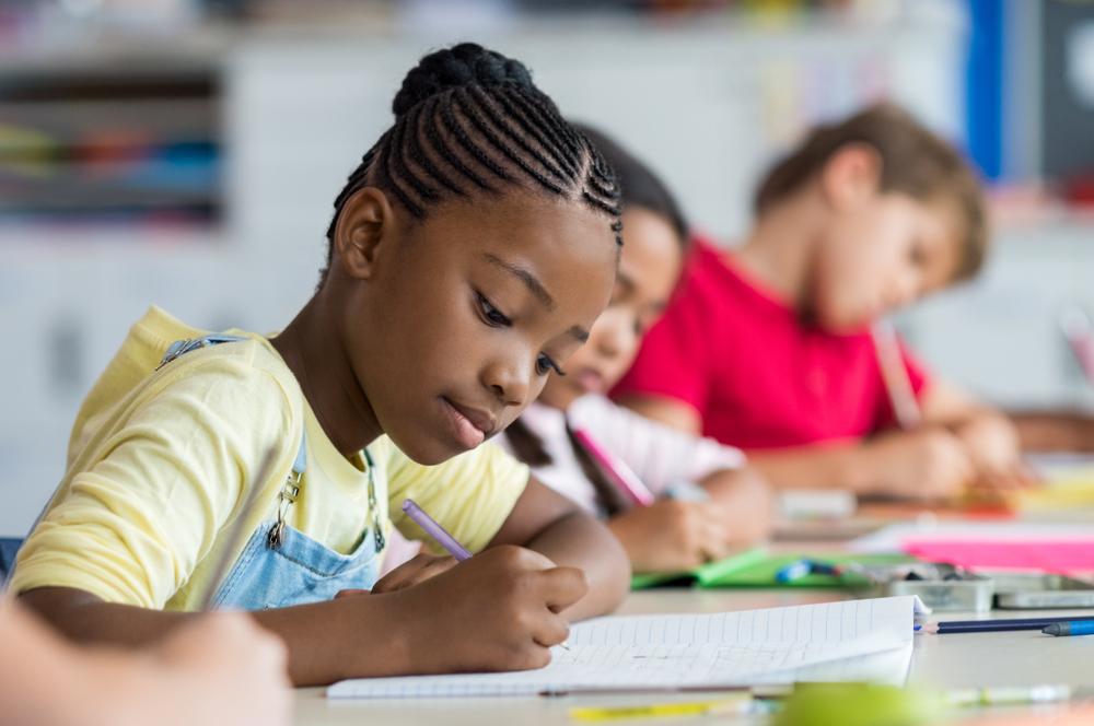 Student at table writing