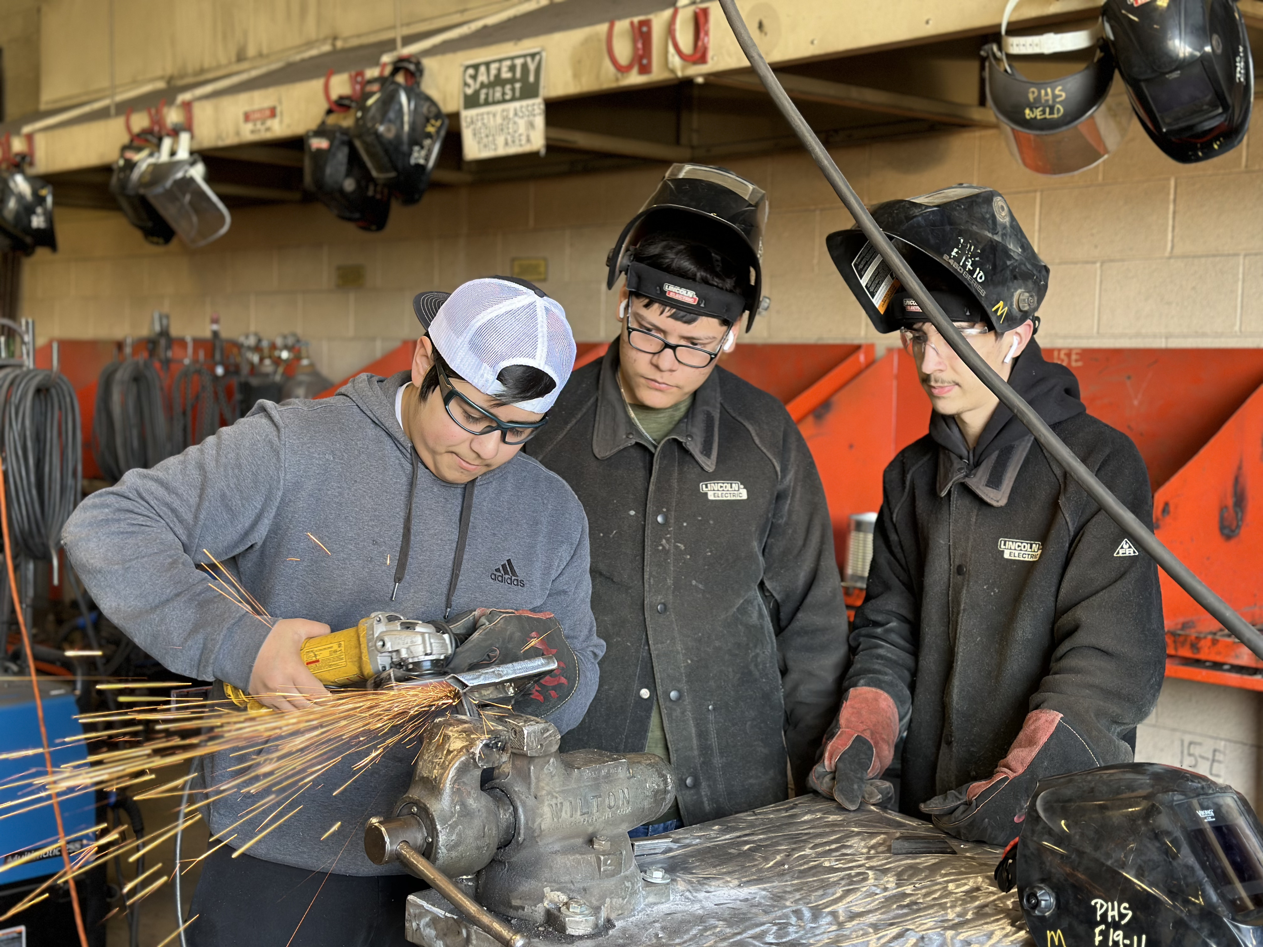 Welding students working on a project