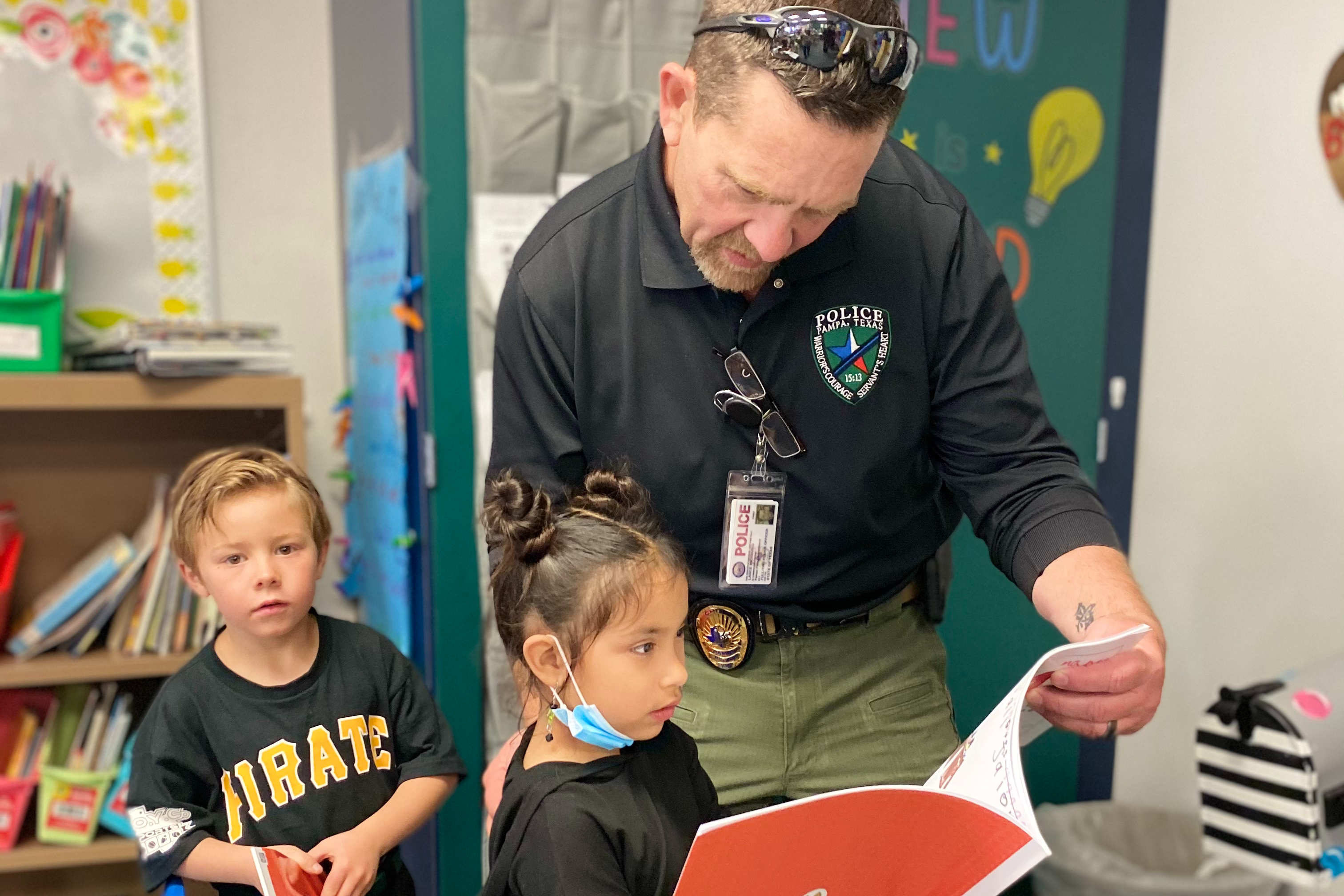 Pampa Police Chief in classroom helping students