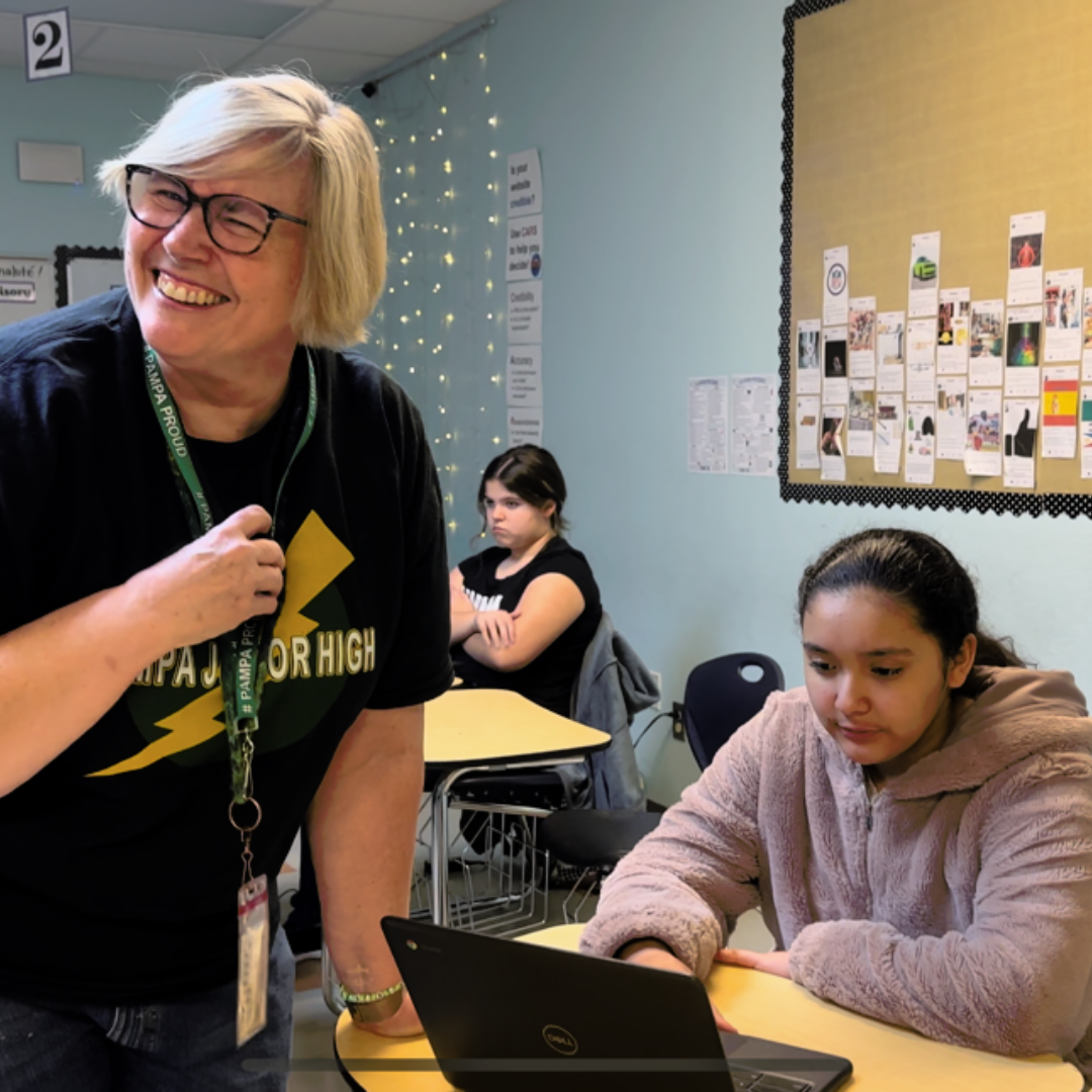 picture of smiling teacher with student