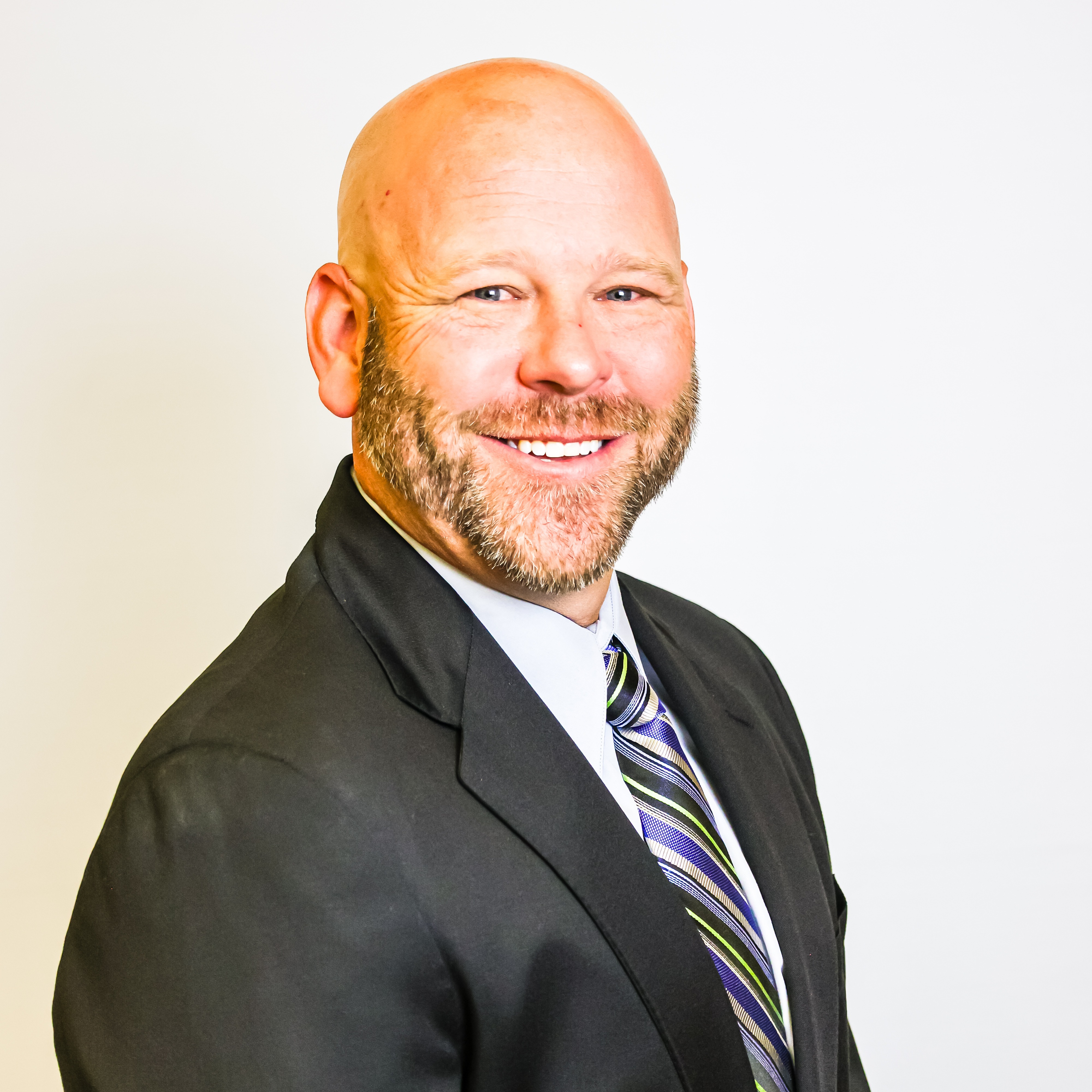 A photo of a man with a suit and tie