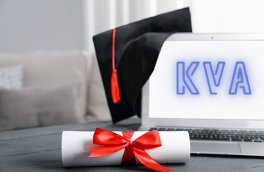 laptop with text K-V-A and graduation cap and diploma
