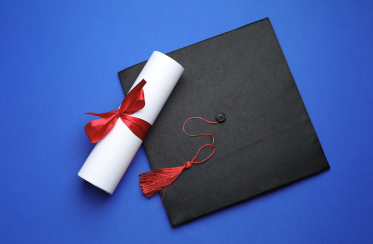 graduation cap and diploma