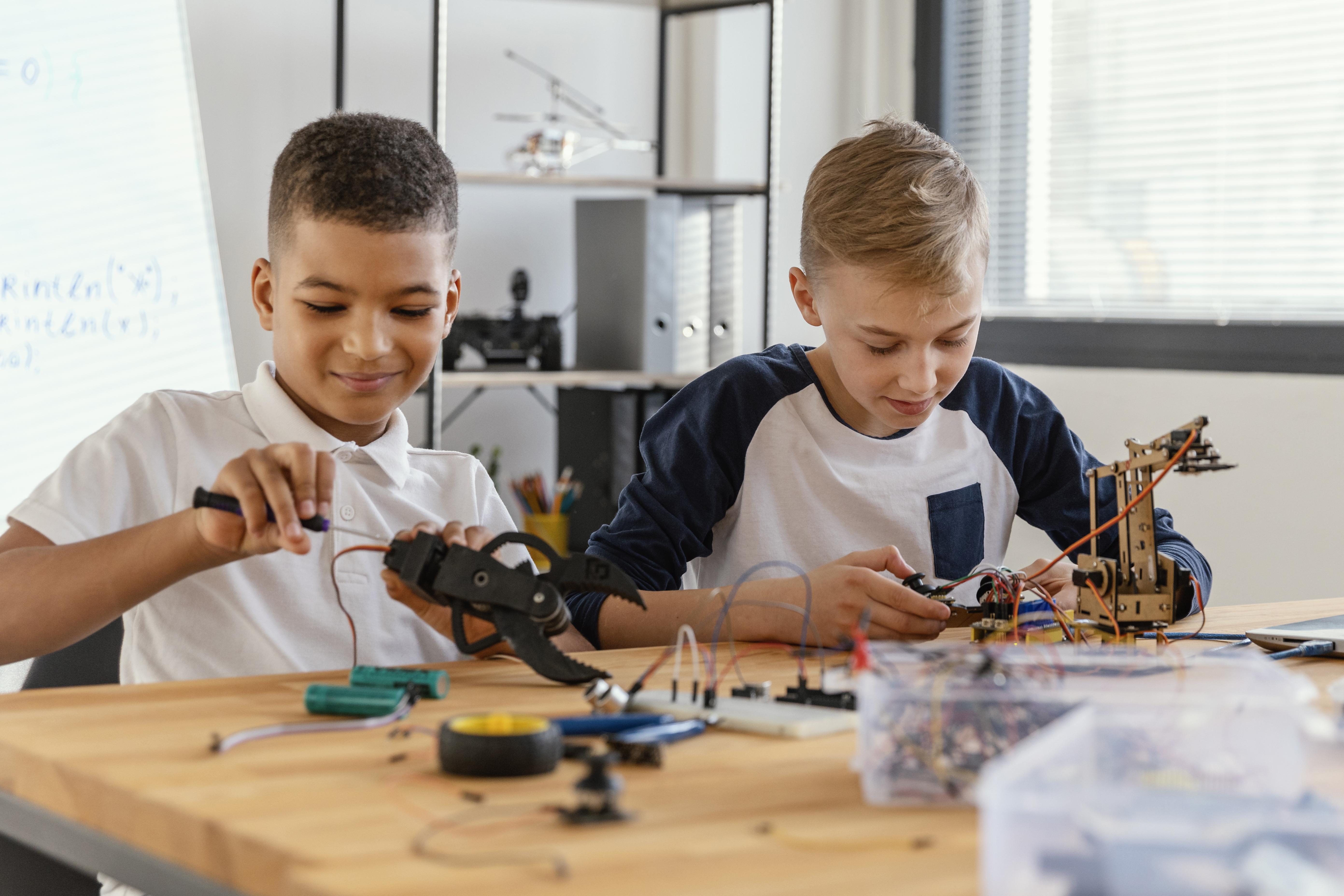 2 students making a robot