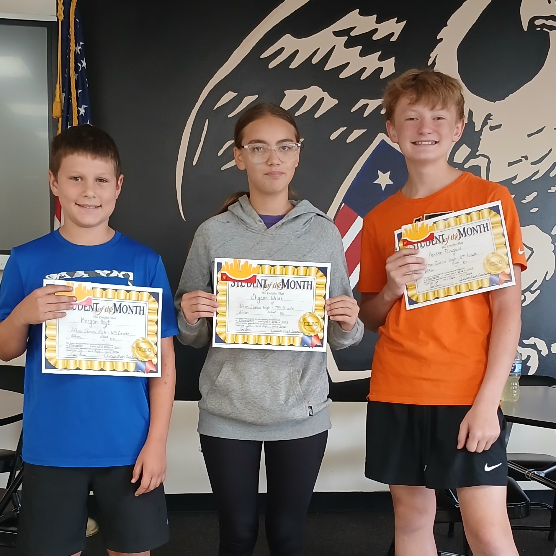 Keegan Hoyt (6th), Shyann Wilde (7th), and Paxton Diuguid (8th) pose with their Students of the Month certificates.