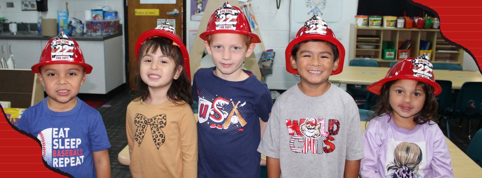 Pre-K students wearing a fireman hat