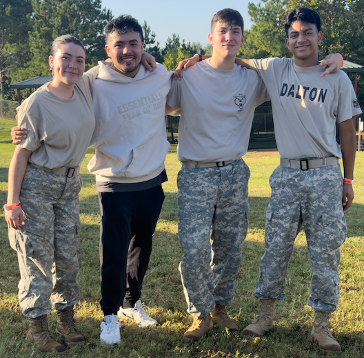 a group of jrotc students smile for a picture