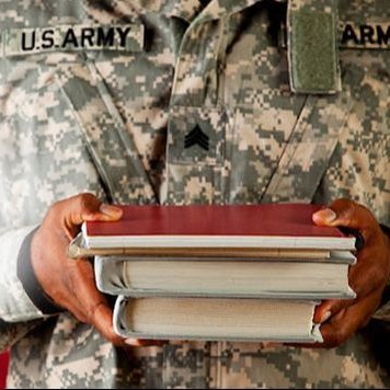 a soldier holding books