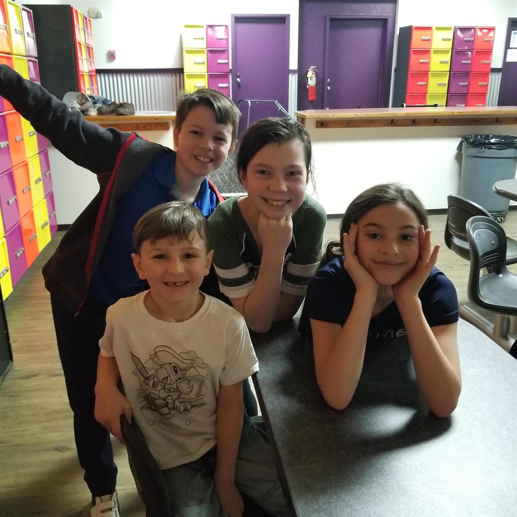 a group of kids posing for a picture