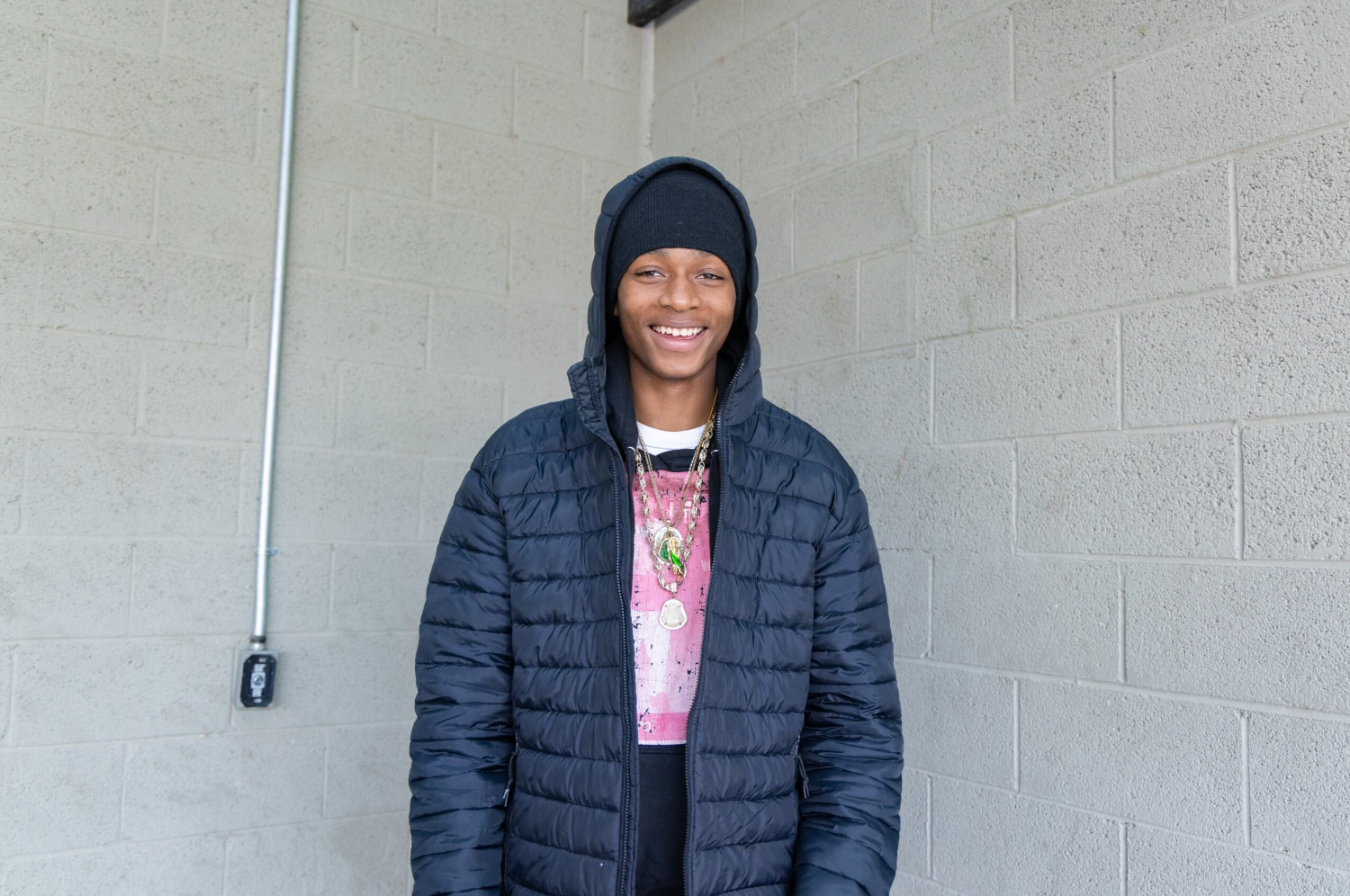 Student in front of wall