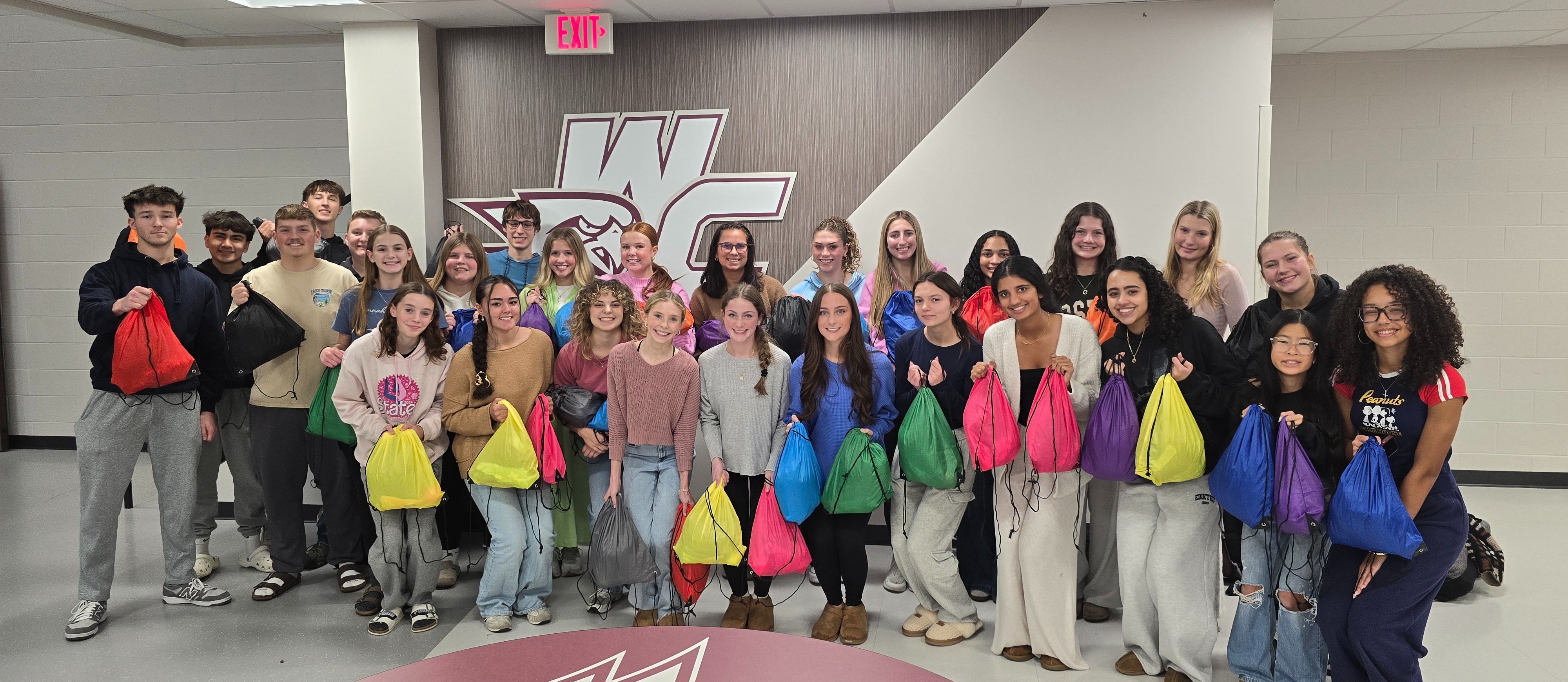 Geography Club students holding goody bags