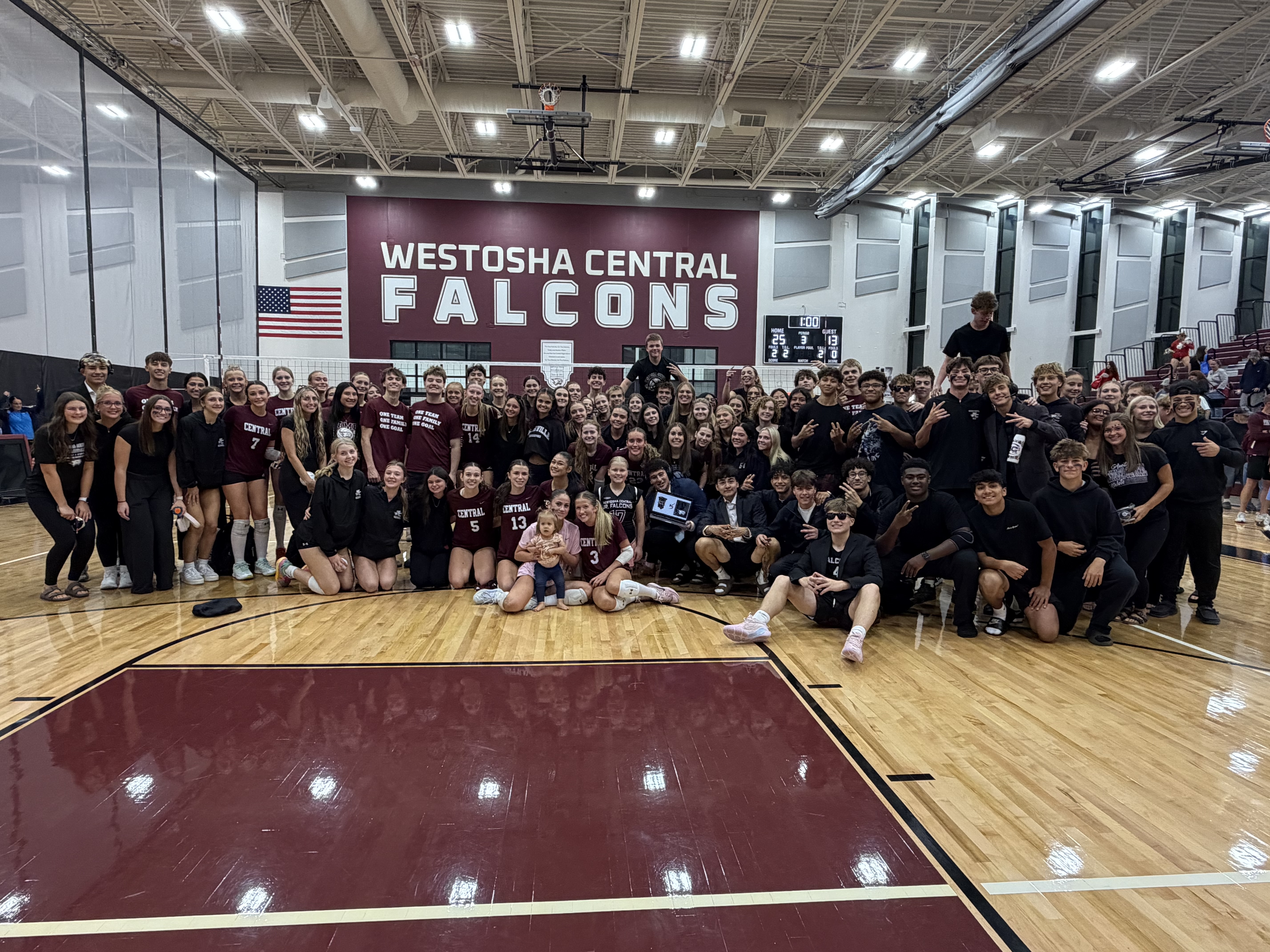 Girl's VB cheering section and team