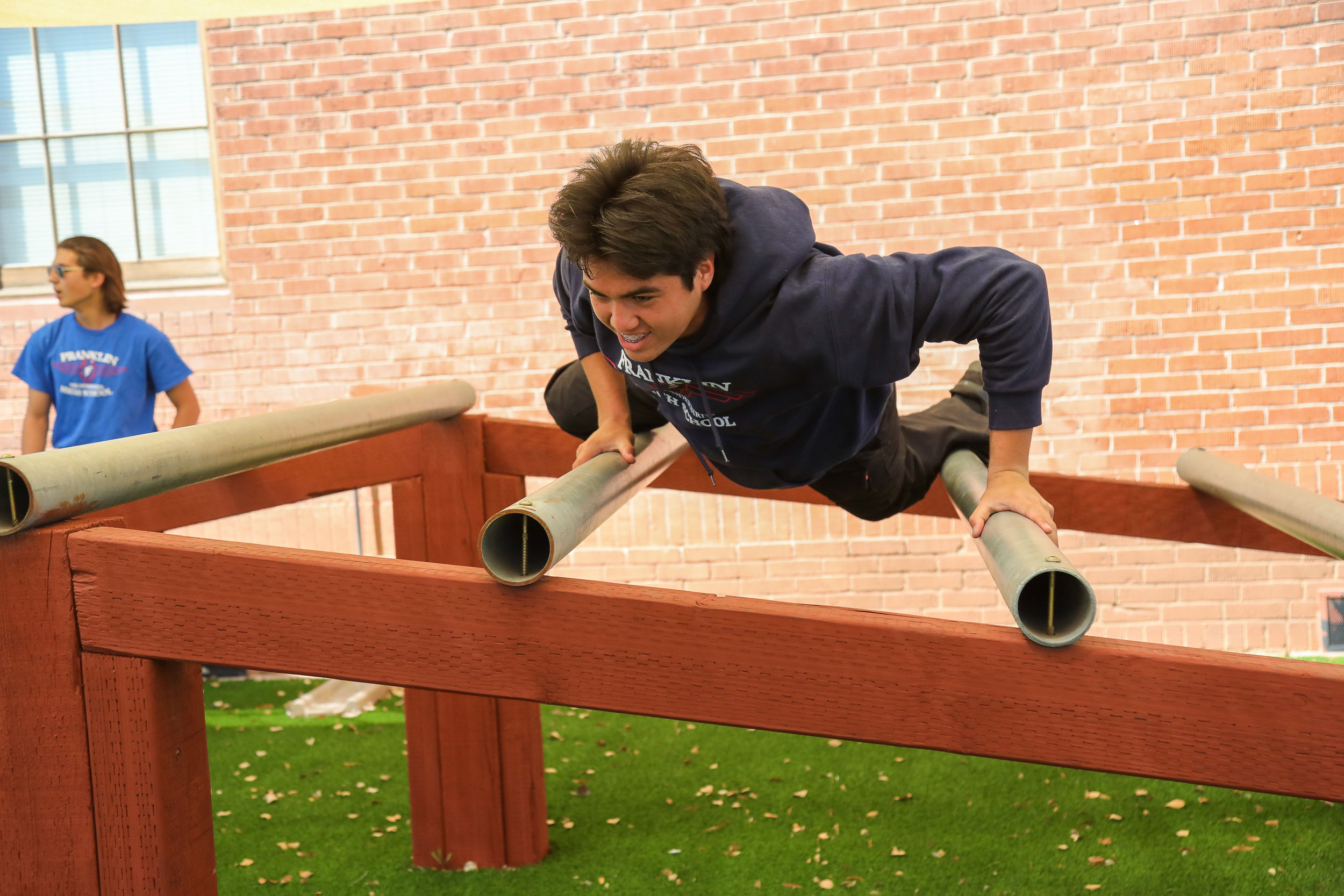 students in fire obstacle course