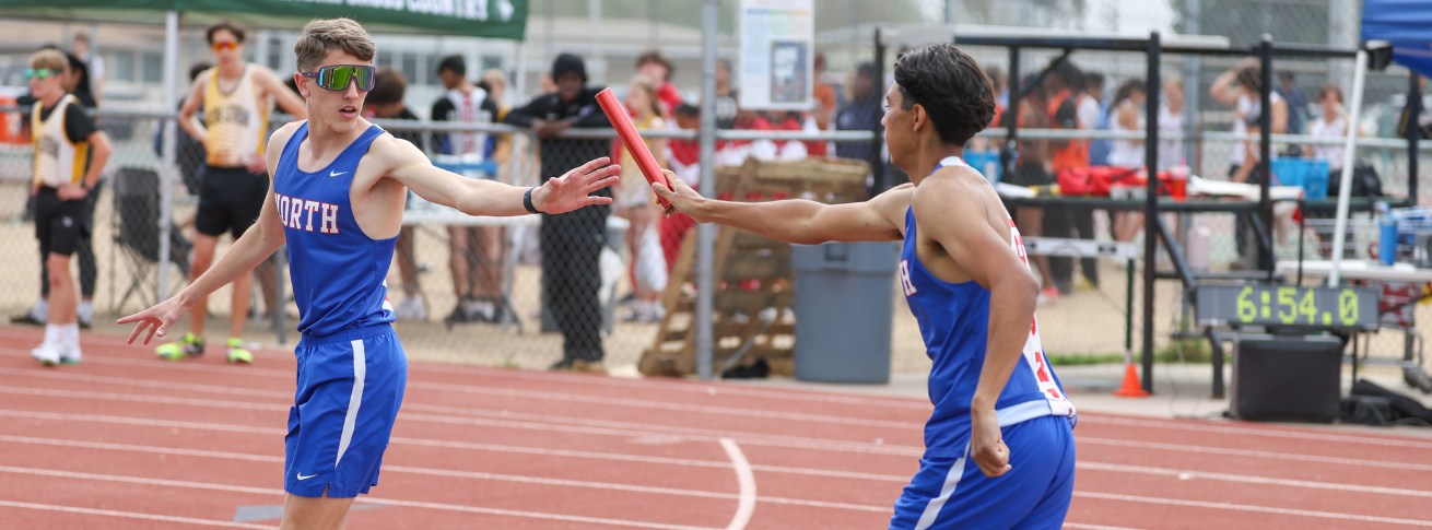 Students passing baton