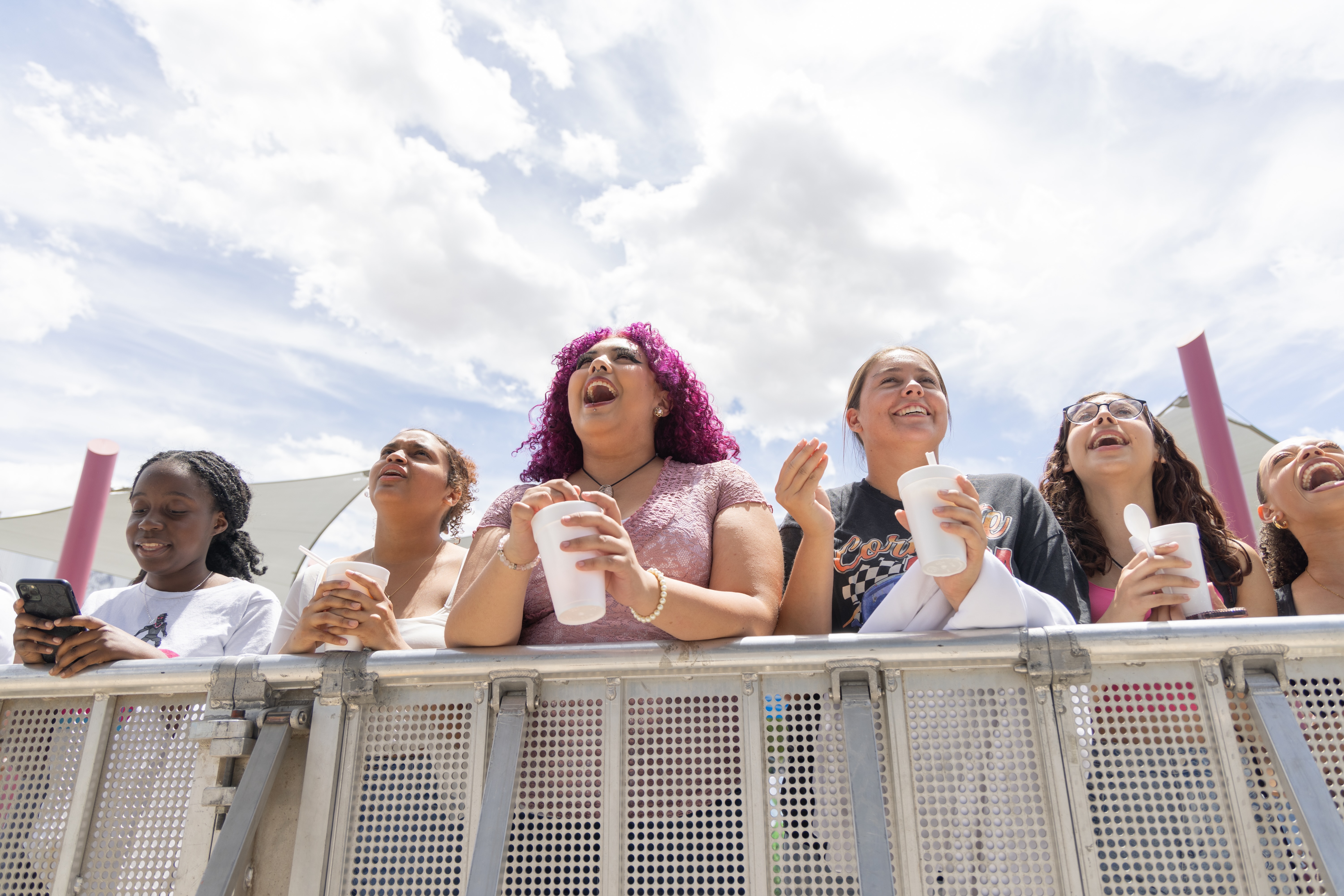 Students smiling at an event