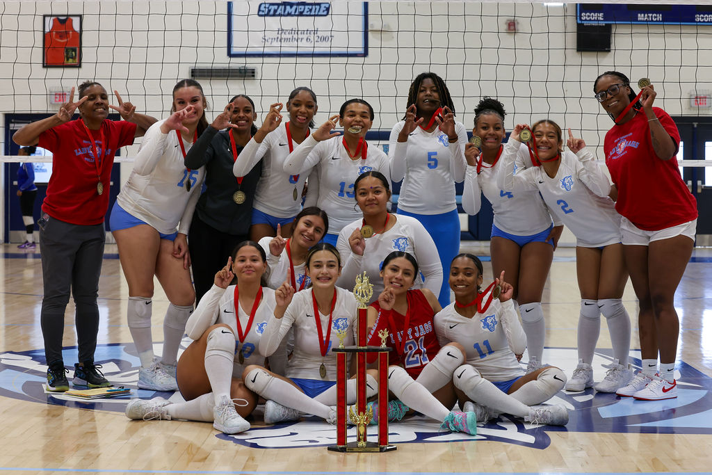 volleyball team with trophy