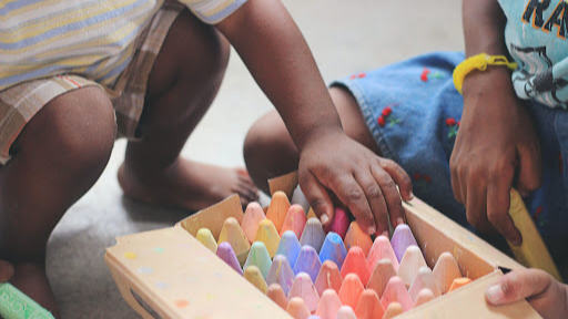 kids grabbing chalk out of box