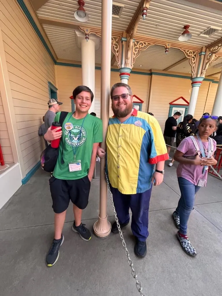 teacher and student posing together