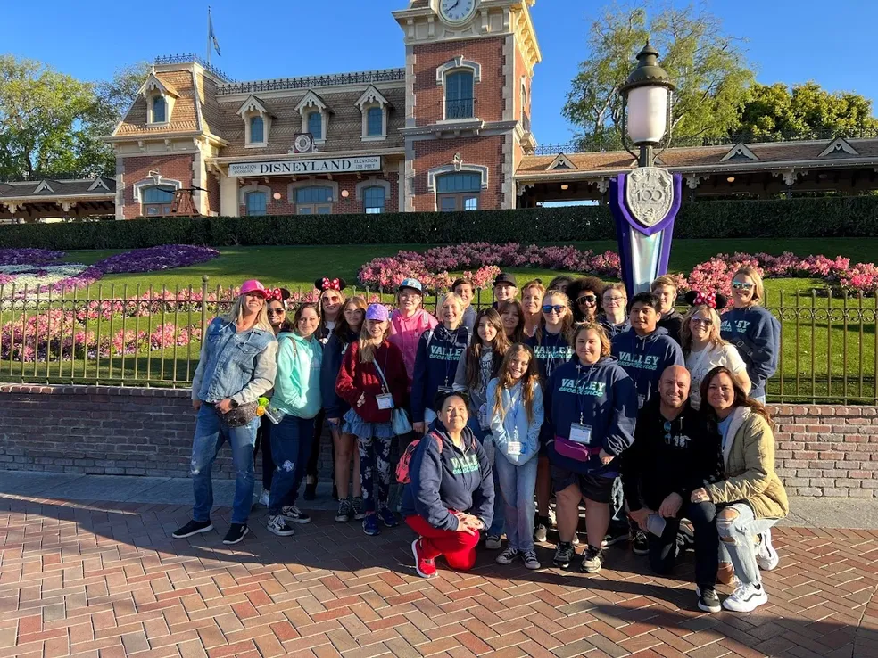 full group posing in theme park