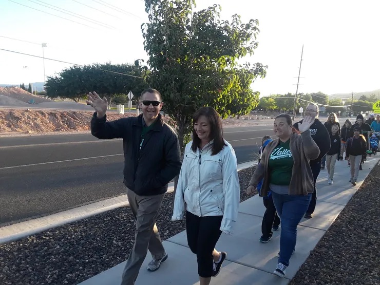 parents smiling walking