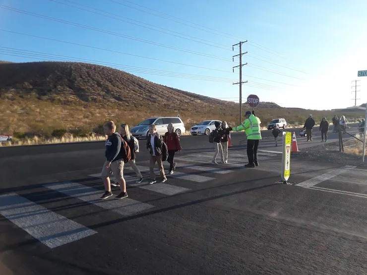 kids walking to school crossing the street