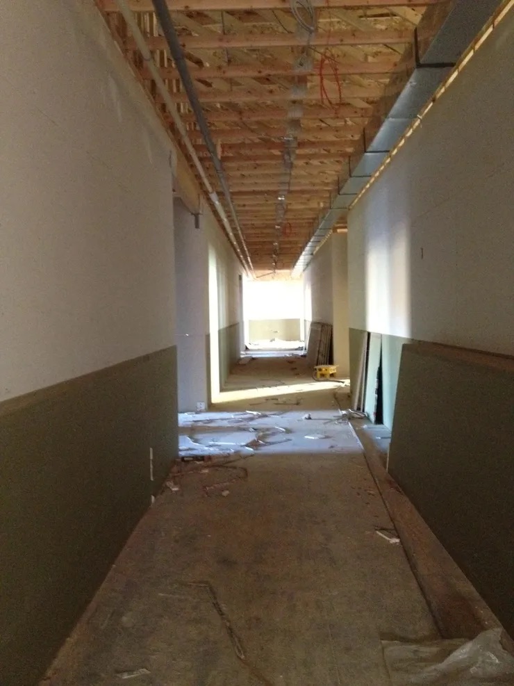 Under construction hallway with no walls.
