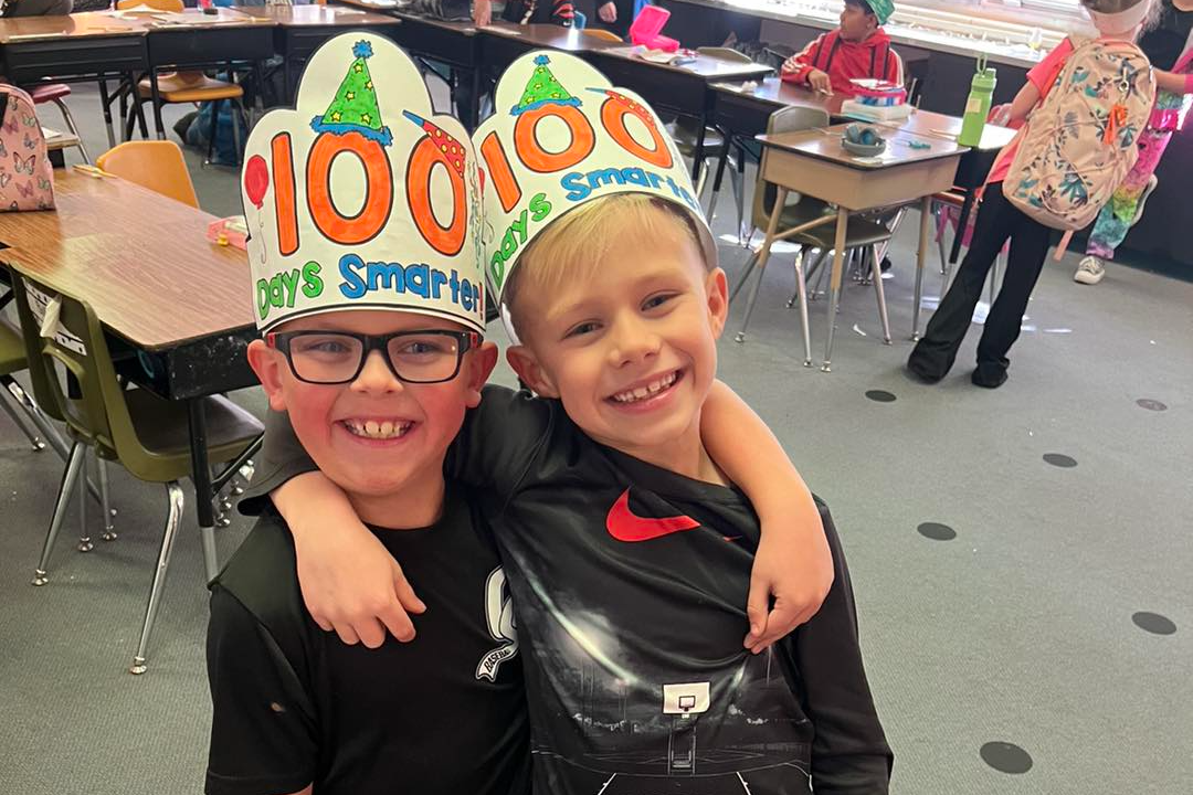 boys wearing 100 days of school hats