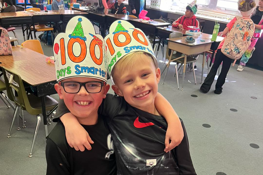 boys wearing 100 days of school hats