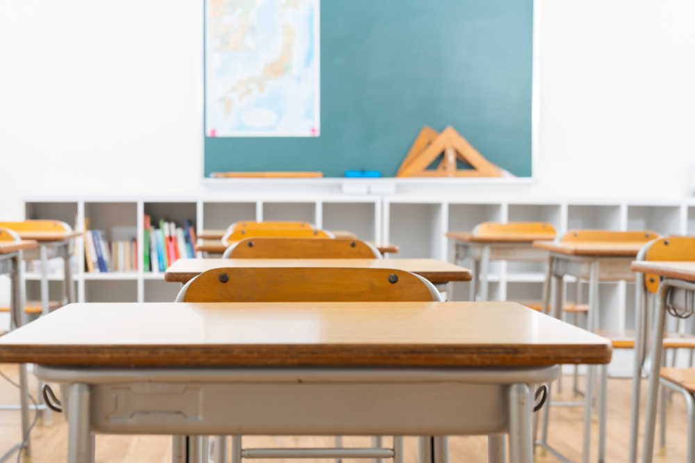 Classroom with desk and chalkboard