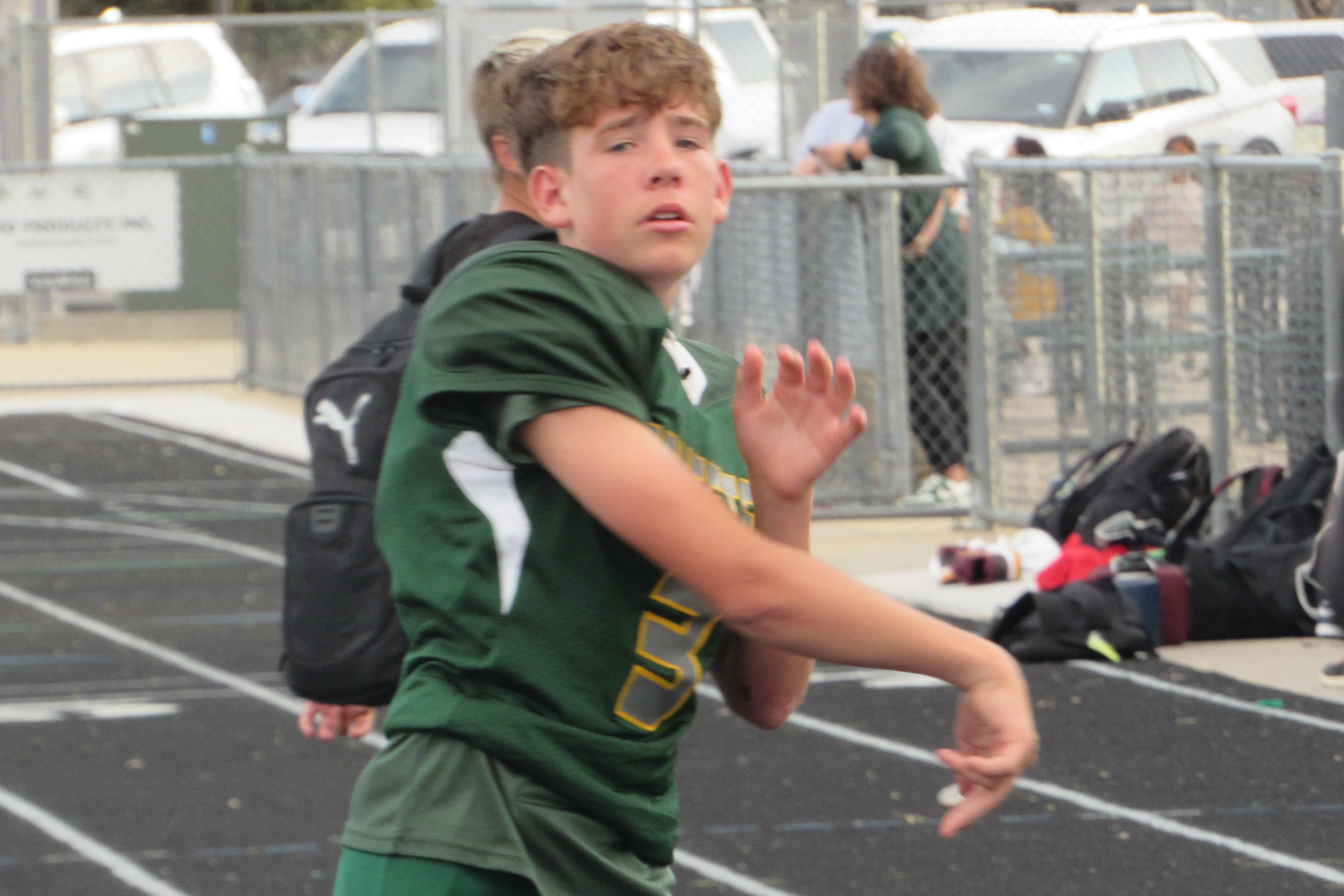 JH student throwing football