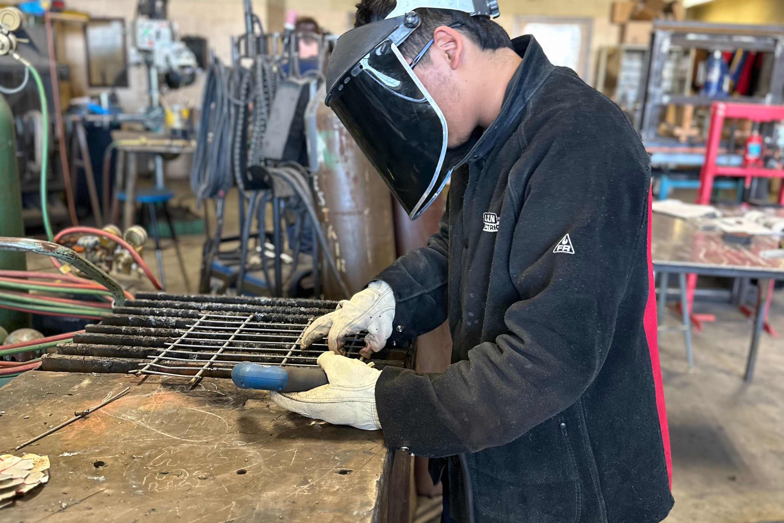 Welding students working on a project