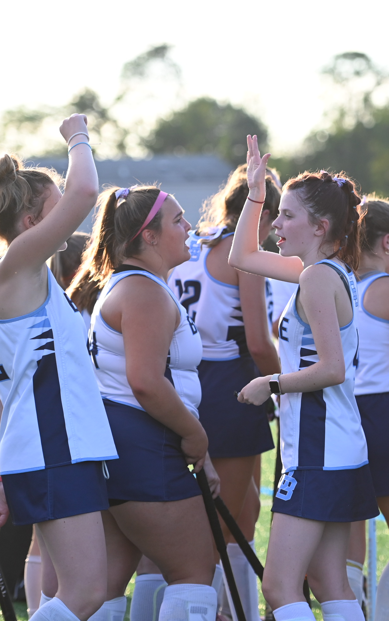 Daniel Boone Field Hockey players high-fiving each other after a game