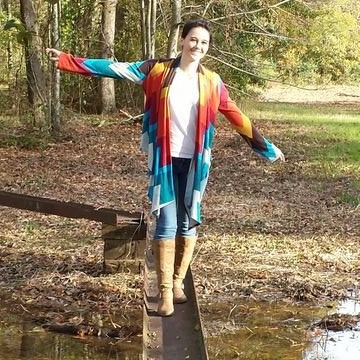 Daughter walking over a puddle