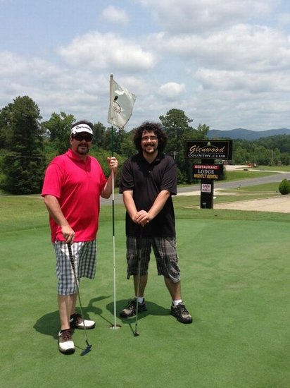 Dad and son on the golf course