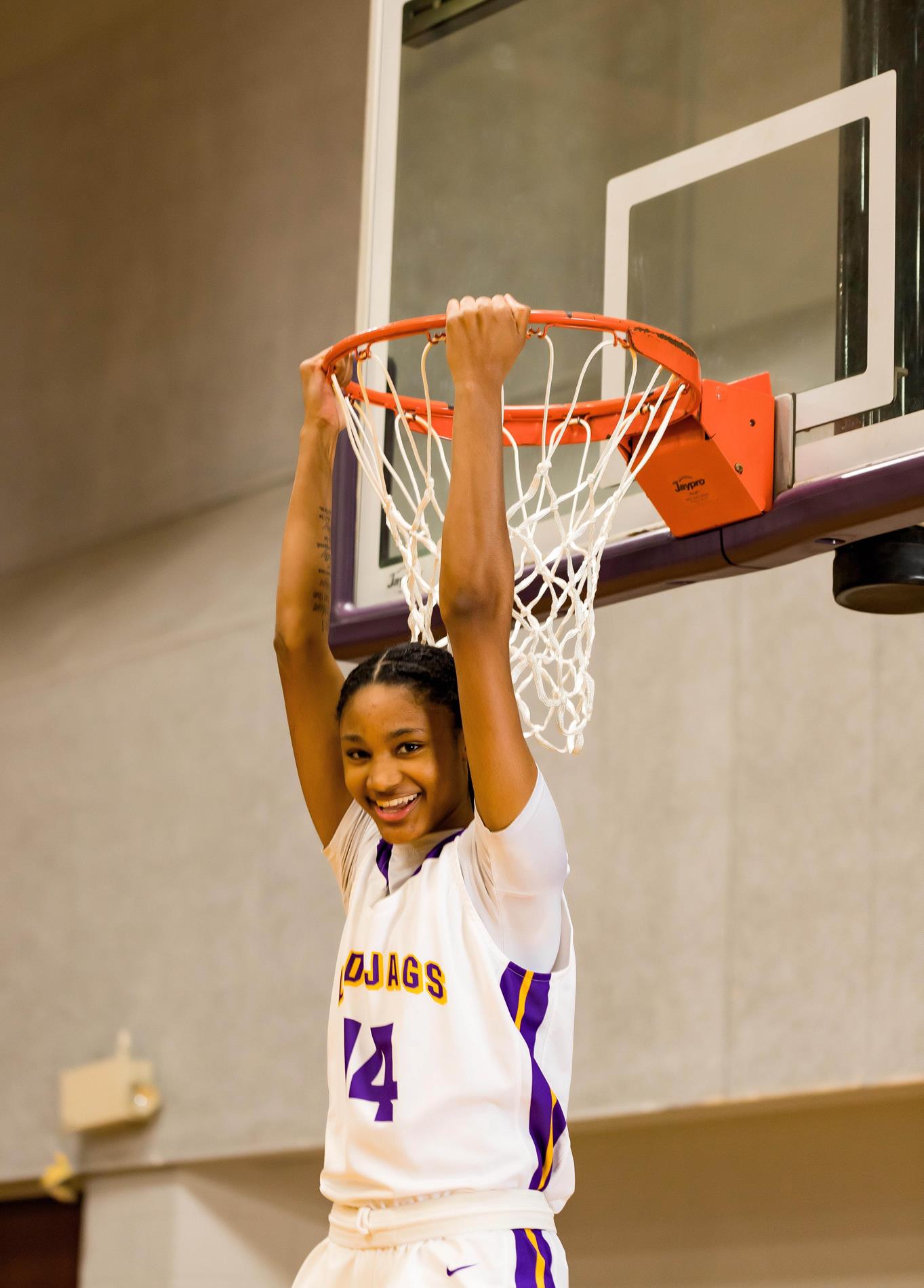 Jamaiya Hasley hanging from the basketball rim