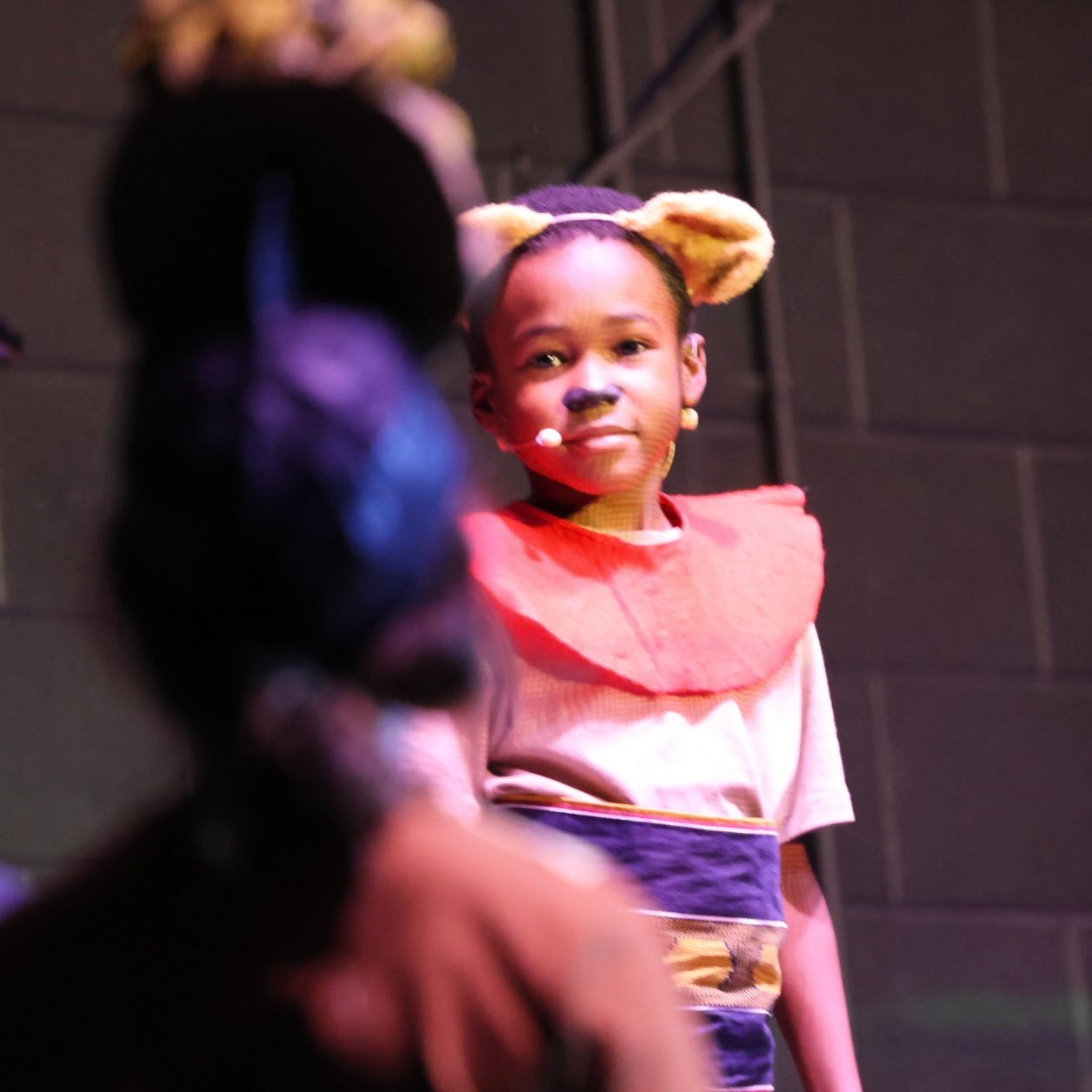 student performing in lion king