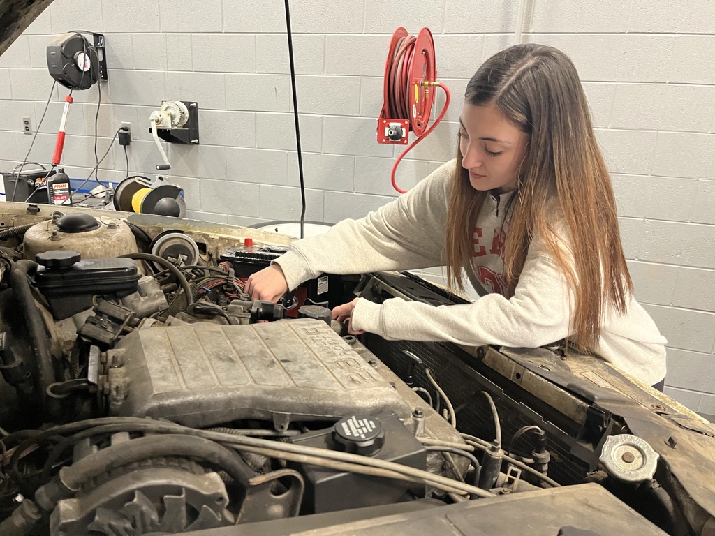 Student working on an engine