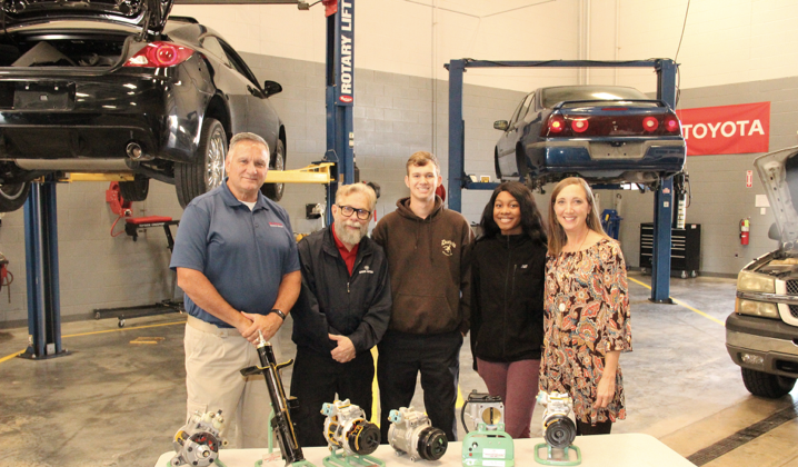 Students and Teachers posing in the shop