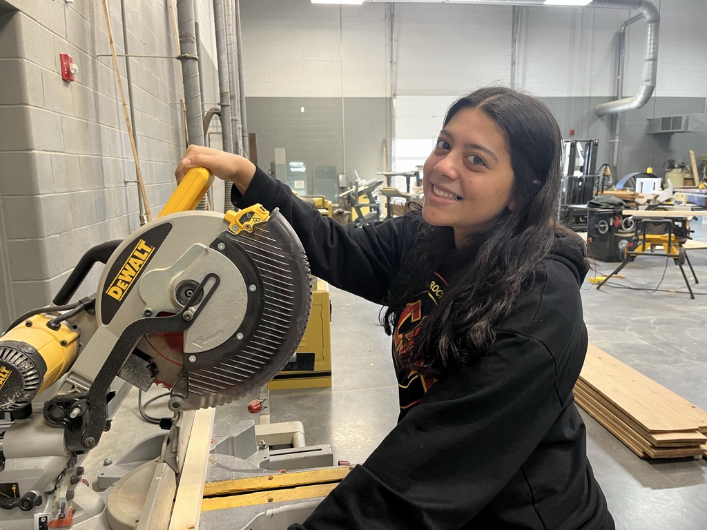 Student using a saw