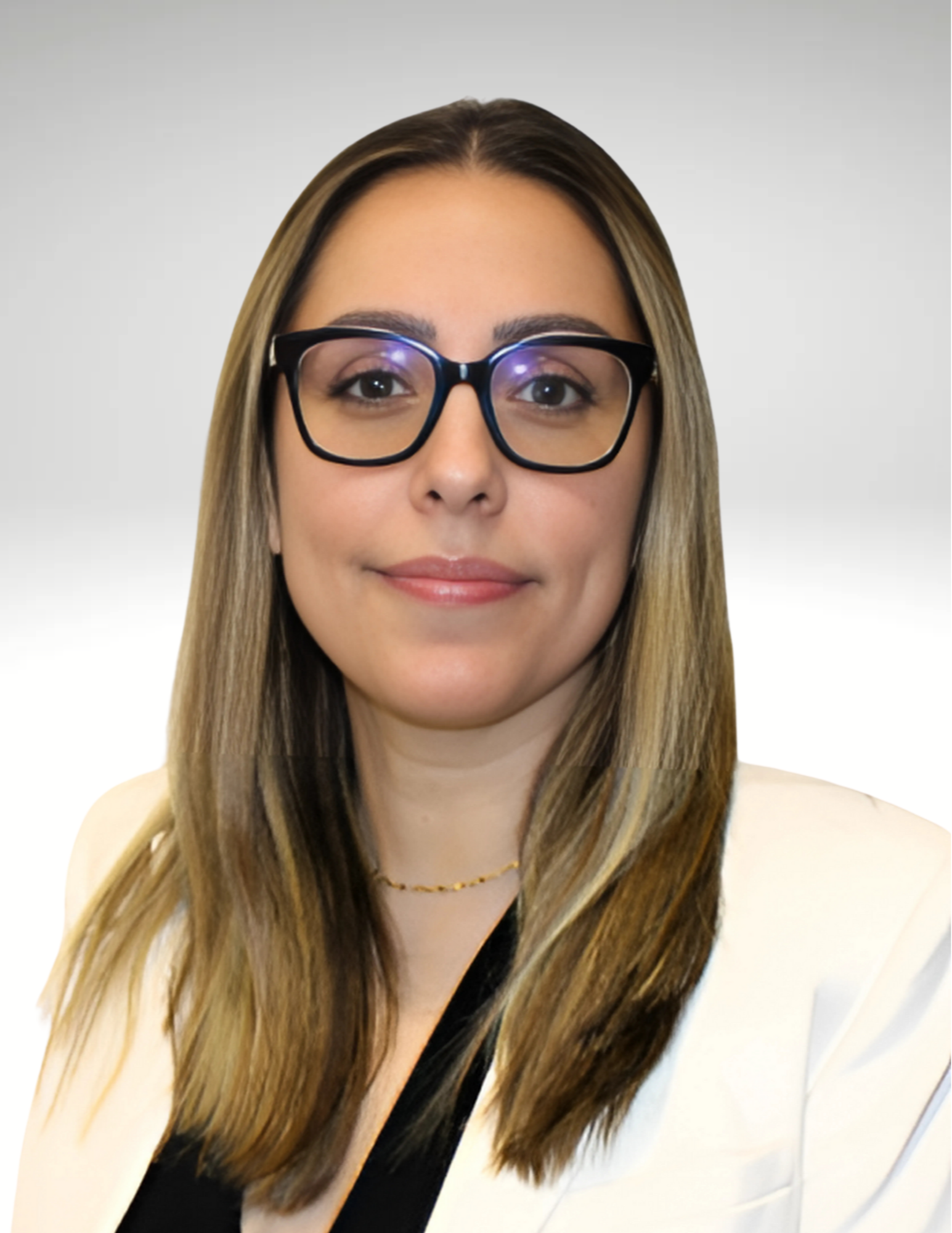 A woman with long, straight hair and glasses is wearing a white blazer and a black top. She smiles slightly, exuding a professional and confident demeanor.