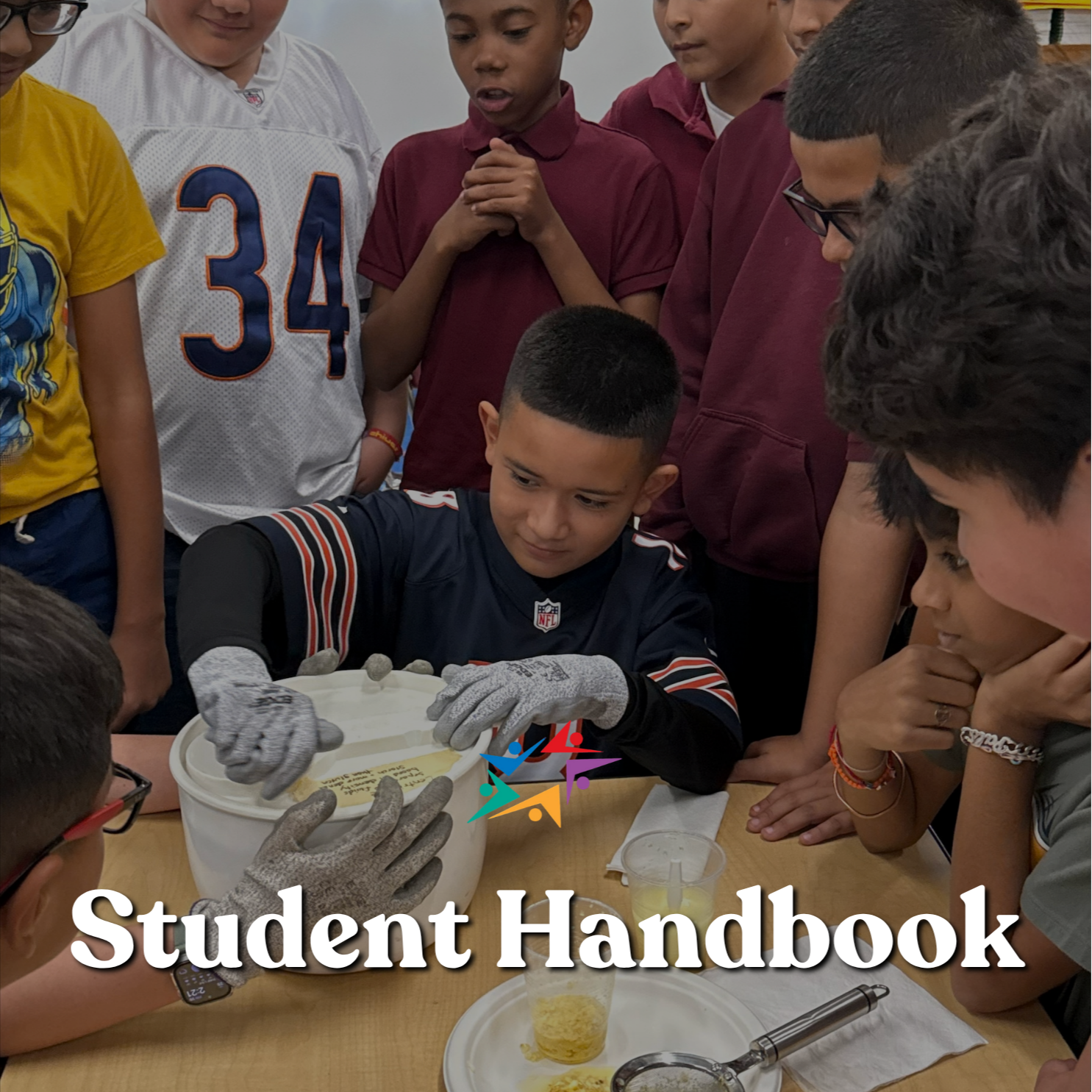 Students gather around a table for a hands-on activity with a bowl and strainer; “Student Handbook” overlays the scene, conveying curiosity and teamwork.