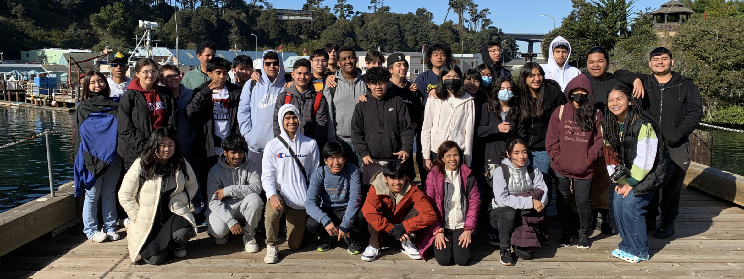 group of students on a dock