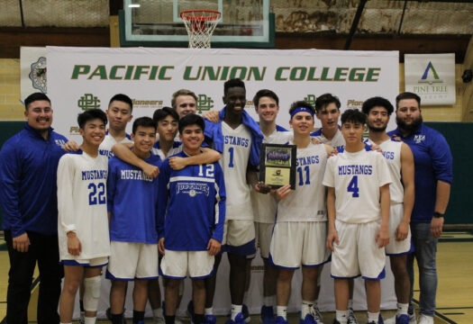 basketball team in a group smiling