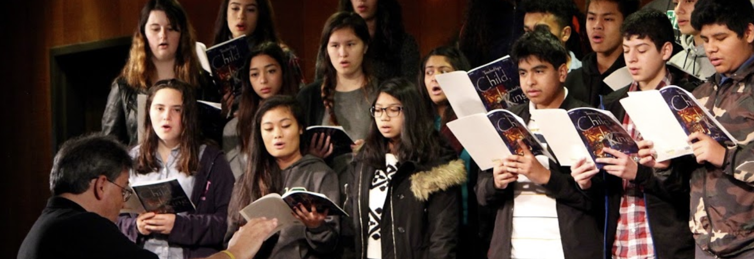 students singing on stage