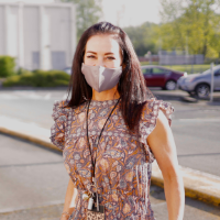 teacher outside of kent school wearing a face mask