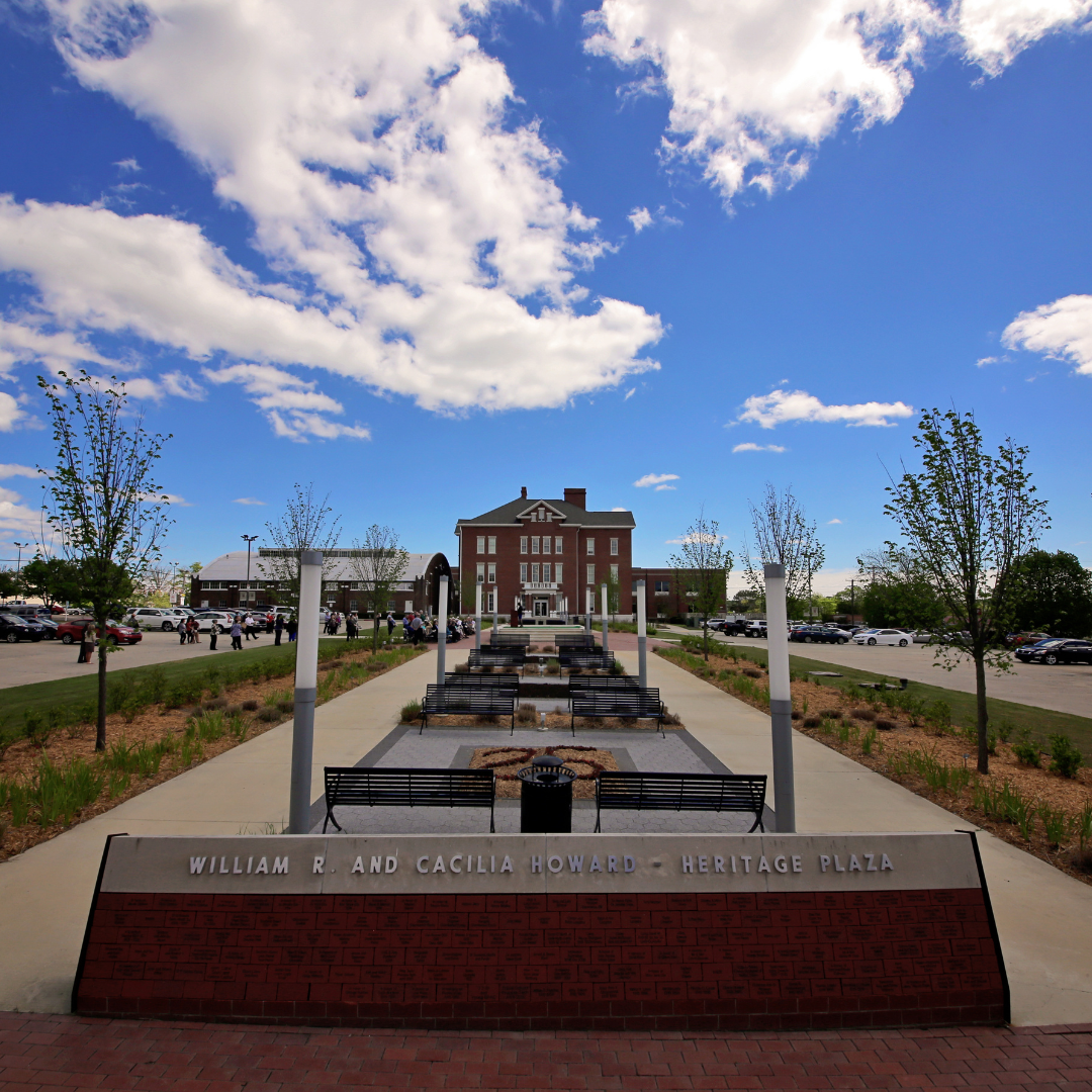 .5 photo of heritage plaza with dedication in front and the Thomas Administration building in the back