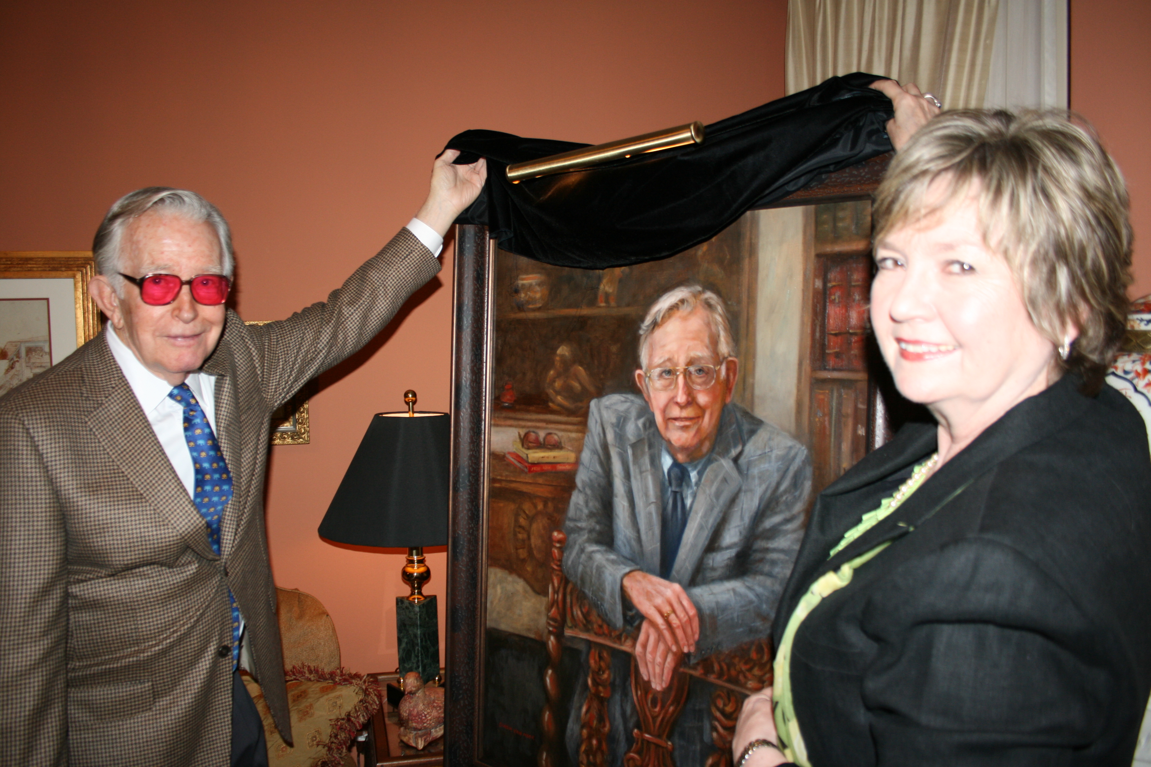 Photo of Charlie Thomas and Dinah Van Hook unveiling Mr. Thomas's portrait